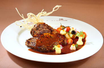 delicious grilled fresh chicken chop meat w black pepper sauce and broccoli salad vegetable in white plate on brown background premium western cafe halal food menu for restaurant