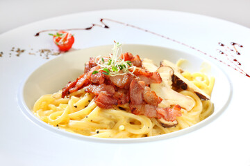 delicious carbonara white milk cream paste w bacon and mushroom in white plate on white background premium western cafe halal food menu for restaurant