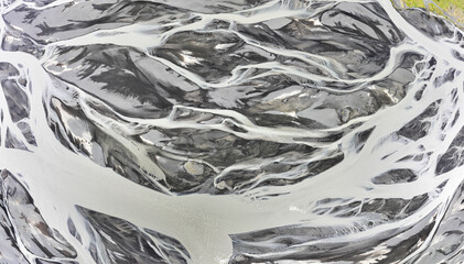 Aerial view of patterns of Icelandic rivers flowing into the ocean. Iceland Drone footage