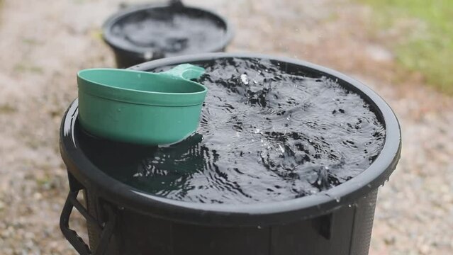 Rain fall into plastic tank, save rain water and rainny season