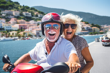 Retired couple on a scooter, happy seniors on vacation