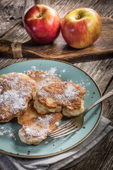 Homemade pancakes on a wooden table.