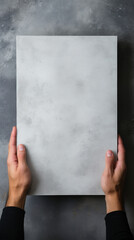 A person holding blank canvas