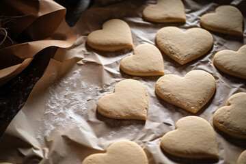 Heart shaped cookies on baking parchment paper