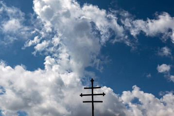 scenic wooden orthodox cross against cloudy sky