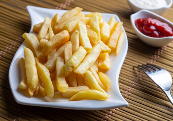 French fries with mayonnaise and ketchup