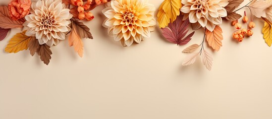Autumn Floral Composition with a border created using fresh flowers on a pastel beige background.