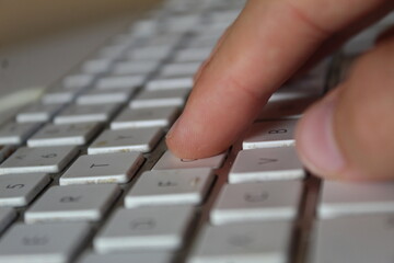 A photo of someone typing on a keyboard. 
