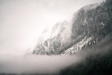 The Enigmatic Splendor of the Alpine Majesty. A Captivating Journey through Moody Peaks and Verdant Valleys. Exploring the Mystical Dolomites in the Italian Alps.