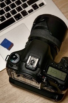 Digital SLR camera and laptop, top view