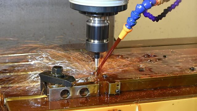 The CNC milling machine cutting the  mold parts by indexable tool with oil coolant method.