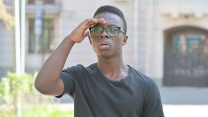 Outdoor Portrait of Young African Man Searching for Opportunity