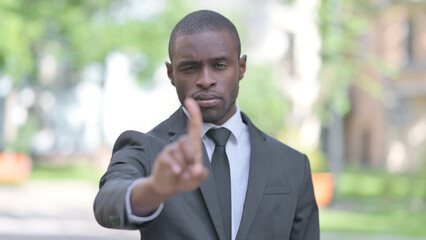 Outdoor Portrait of African Businessman in Denial, Stop Gesture