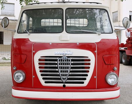 Tricesimo, Italy. September 25,2022. Front view of vintage red lorry Alfa Romeo Mille, manufactured from Fifties till Sixties. 