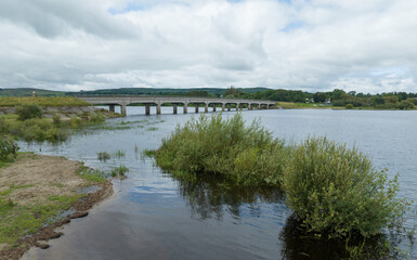 Fototapeta na wymiar road bridge over blessing ton lake reservoir, county wicklow, ireland