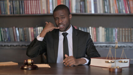Helping African Male Lawyer with Call Me Gesture