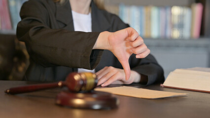 Close Up of Thumbs Down by Female Judge in Court, Scale on Justice