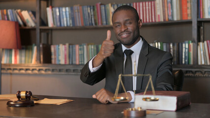 Thumbs Up by African American Lawyer in Office