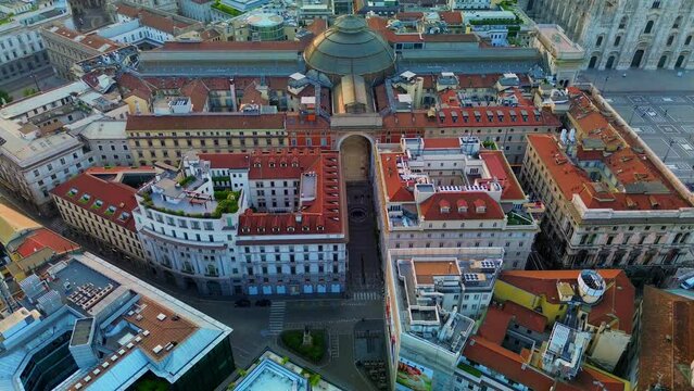 Aerial view of the roof of the famous Galleria victorio emmanuele and the square of the duomo in front of the gothic cathedral. Urban landscape in autumn. Shooting from a drone. Teatro alla scala