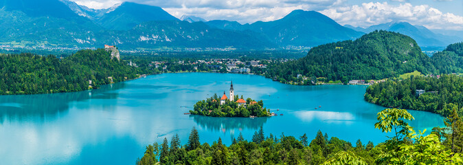 A panorama view from the Ojstrica viewpoint towards the islet on Lake Bled, Slovenia in summertime