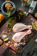 Sensory Indulgence: Exquisite 4K Top View Close-Up of Fresh Raw Chicken Drumstick Adorned with Spices on Wooden Surface