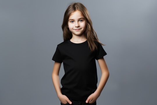 Portrait of a fictional young little girl wearing a plain black t-shirt. Isolated on a plain neutral background. Generative AI.