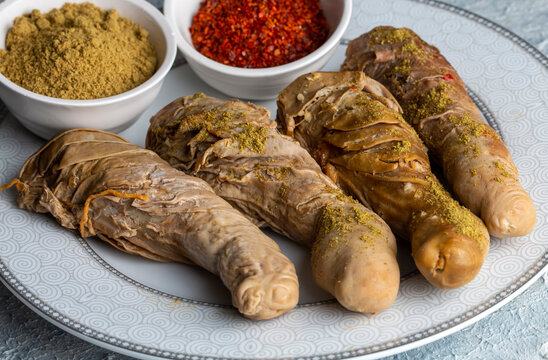 Traditional Turkish Stuffed rice tripe or offal food on the table in Turkish Restaurant. Shirdan Dolma is the favorite food Adana city of Turkey. (Turkish name; Sirdan)