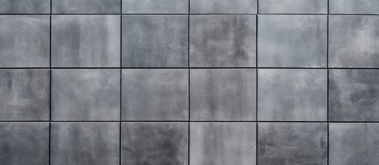 Rows and lines of square sidewalk tiles in a gray color are found on floors either outside or