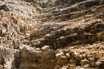 Scenic view of a rocky hill with an array of broken rocks scattered across