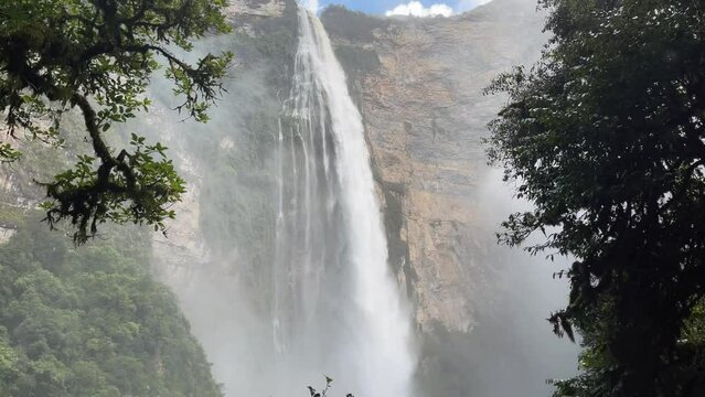 Beautiful flowing Gocta Waterfall in Peru on a sunny day