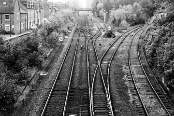 Fototapeta na wymiar old well worn black and white railroad tracks