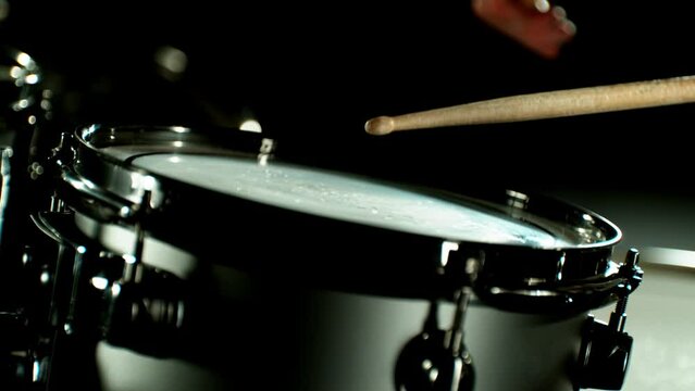 Super Slow Motion of  Drummer Banging on Drums. Filmed on High Speed Cinema Camera, 1000 fps. Speed Ramp Effect.