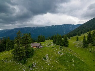 Fototapeta na wymiar Pastoral scene of a traditional sheepfold in the picturesque Piatra Craiului Mountains in Romania