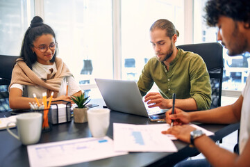 A group of young freelancers working in a coworking space