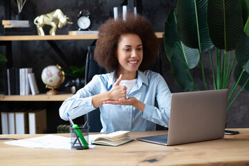 Young deaf african-american businesswoman have digital virtual online conference with employees on...