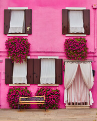 Front of the pink house on the island of Burano, Venice - 631542545