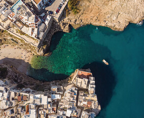 Aerial view of Polignano a Mare, a village built on the edge of the sandstone cliffs above the...
