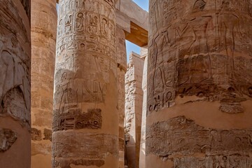 Shot of the detail of the columns with closed papyriform capitals in Karnak temple, Egypt