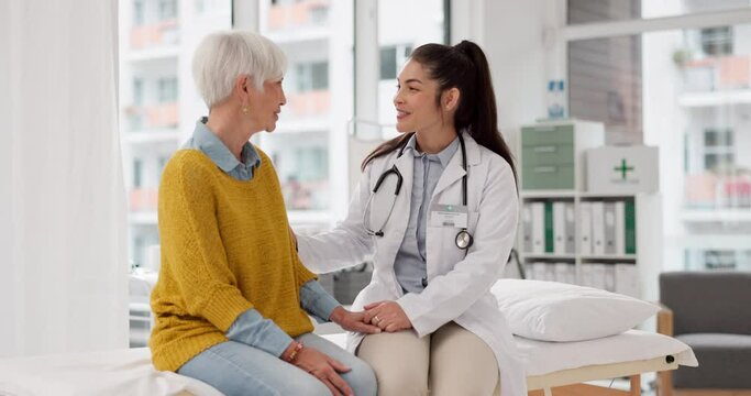 Holding hands, happy or doctor with patient in consultation for healthcare advice or checkup at hospital. Support, cancer therapy or medical worker talking to person in appointment for medicare
