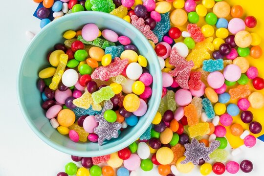 Ceramic bowl filled with an array of colorful candy and candies