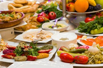 Appetizing variety of traditional Georgian food laid out on a long table