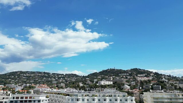 Drone footage over Hotel Martinez over cars in the street in Cannes La Croisette