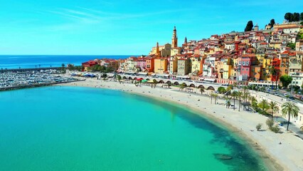 Drone footage around seaside Menton with colorful houses on a sunny day