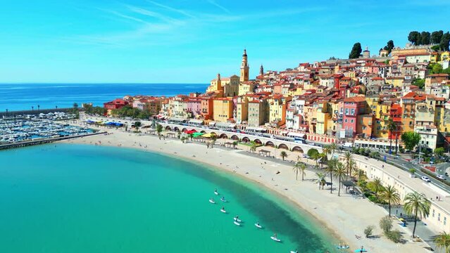 Aerial of the colorful buildings of Menton commune in France alongside the blue sea
