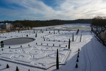 Winter at the Chateau of Versailles Park in the Snow.