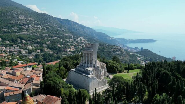 Drone shot over Tropaeum Alpium with seascape on a sunny day