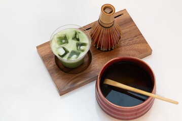 Closeup of a glass of delicious matcha on a tray on the table
