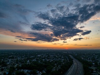 Aerial view of a cloudy but beautiful sunset over Southern State Parkway on Long Island, New York
