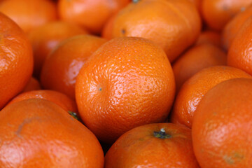 Pile of shiny ripe orange