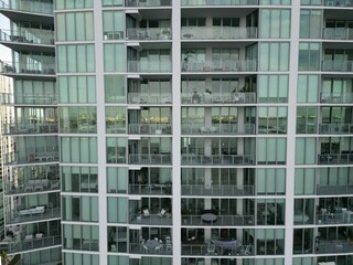 Fototapeta na wymiar Modern high-rise building with condominium balconies in Miami, Florida